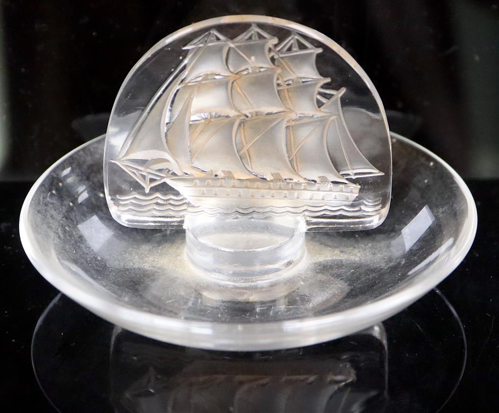 René Lalique. A pre-war amber tinted glass Caravelle pattern cendrier, no.312, designed in 1930, 10cm diameter